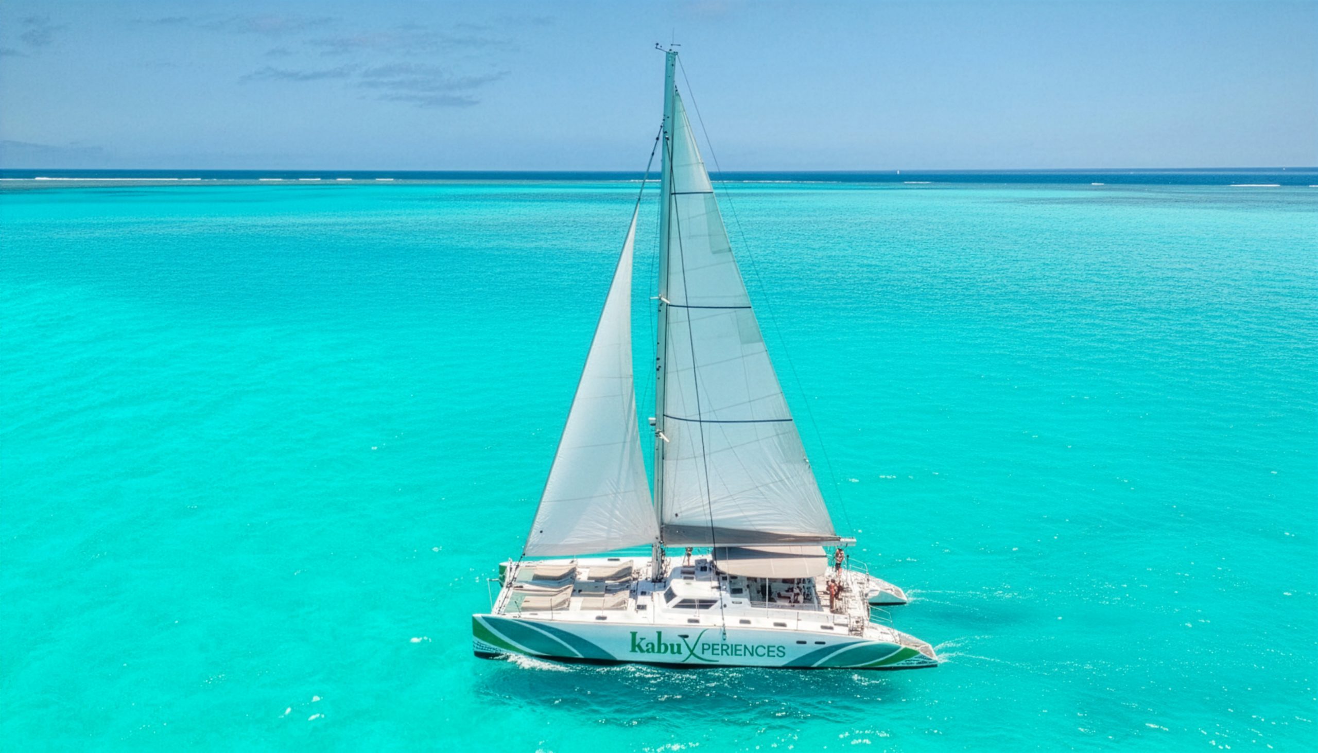 Catamaran Marina Adventur sailing over the turquoise waters of Cape Verde, offering an exclusive sea and adventure experience.